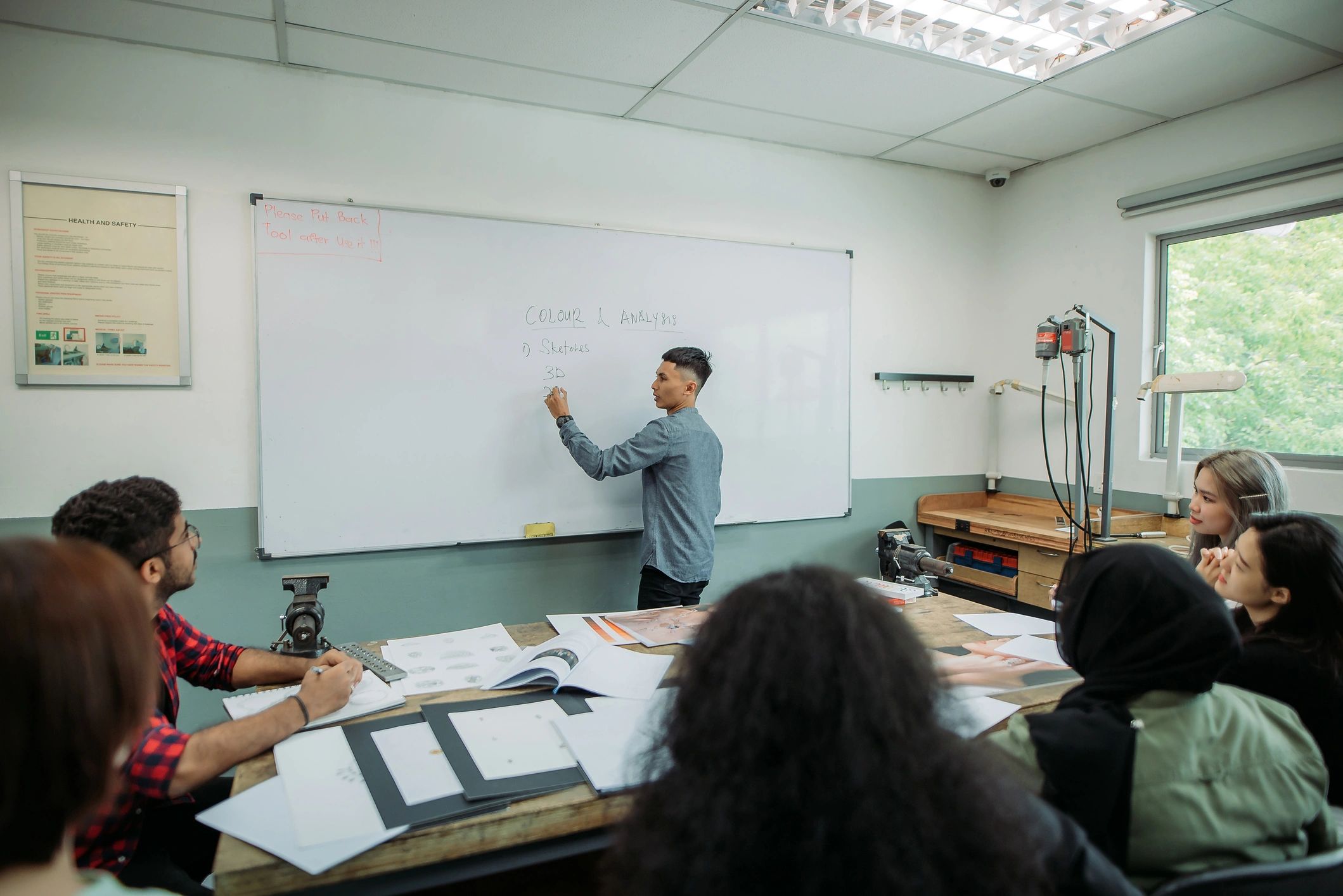 Teacher delivering a classroom lecture