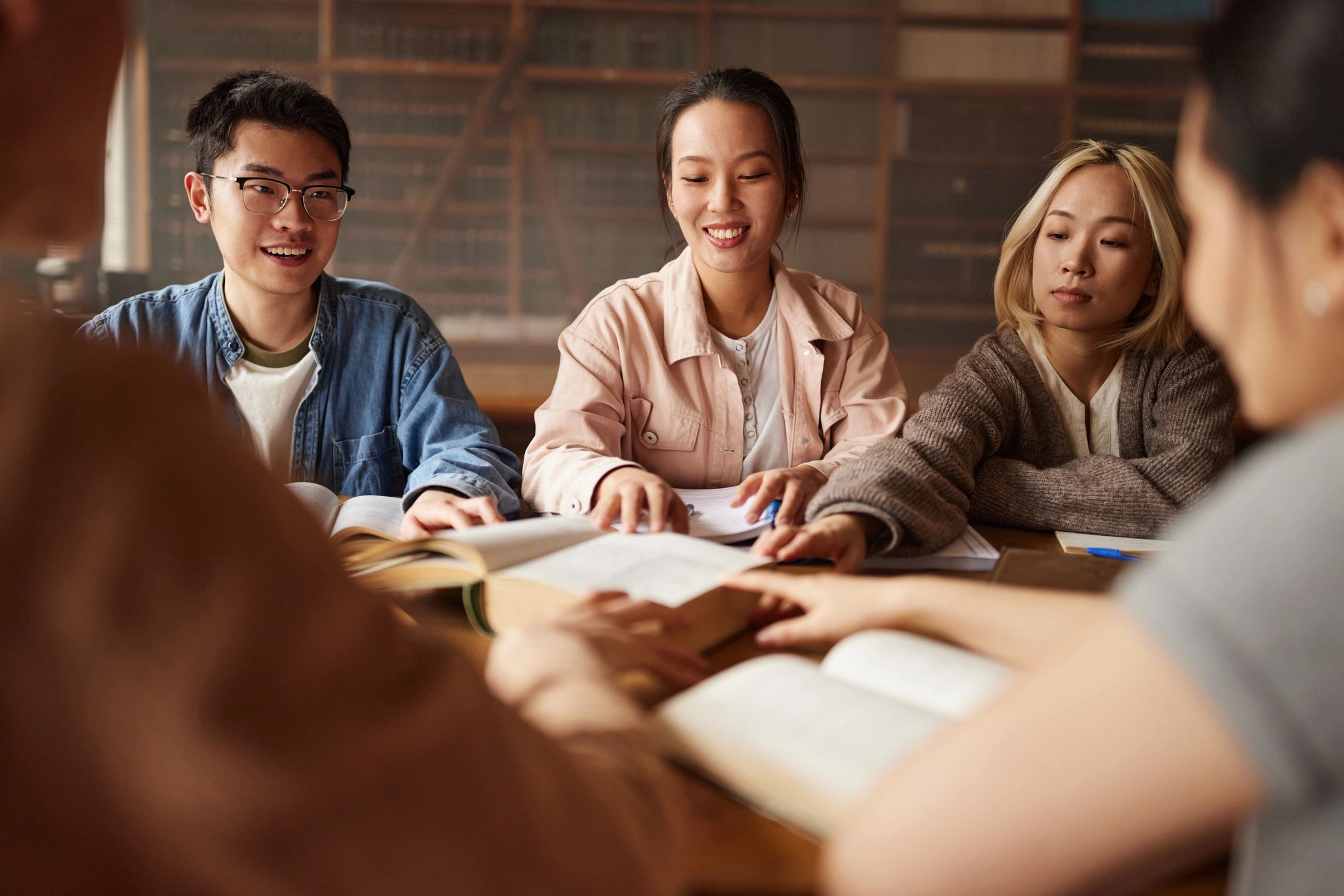 Students studying together in a library