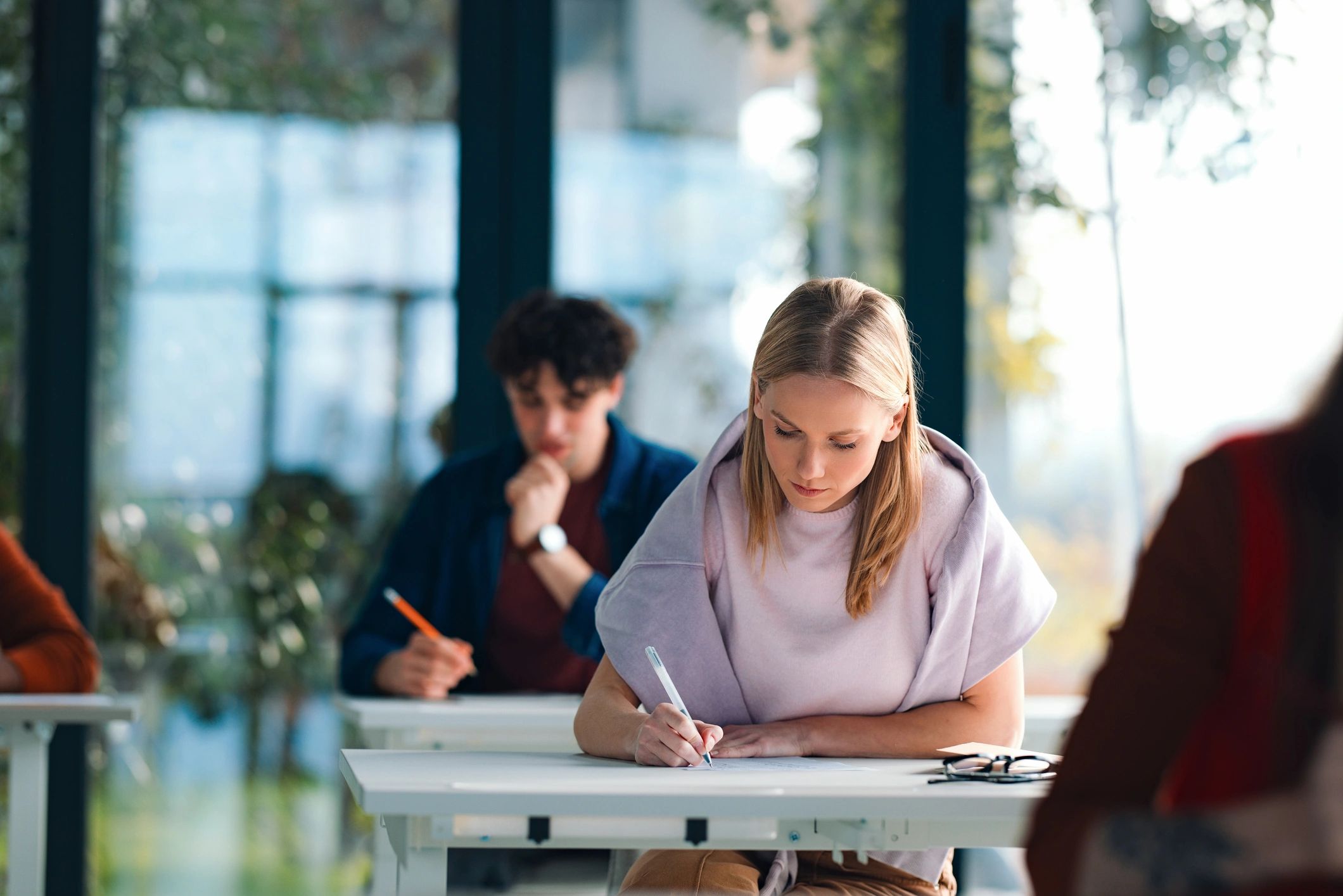 Students preparing for exams together in a modern classroom