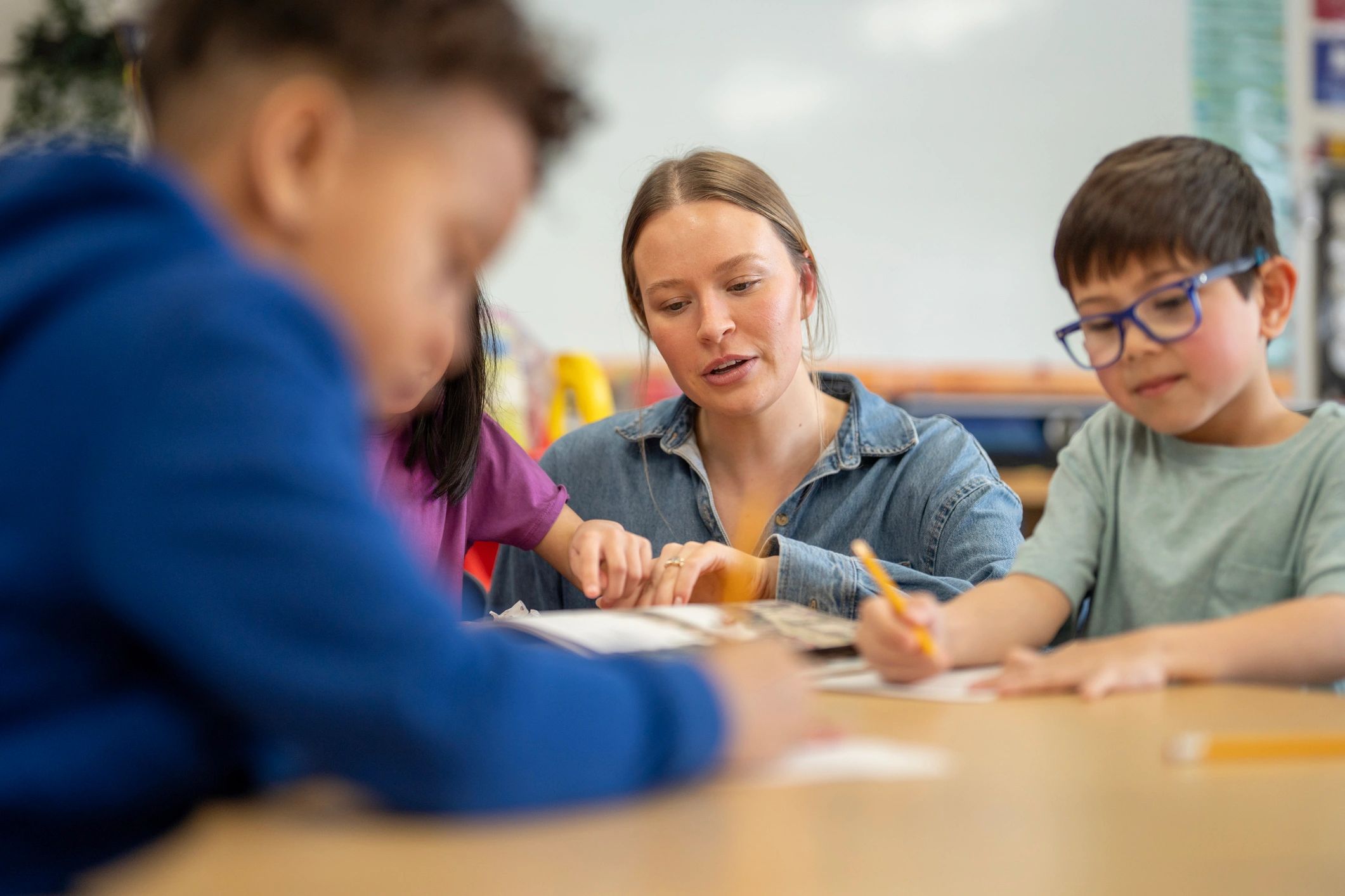 Teacher coaching students during a lesson