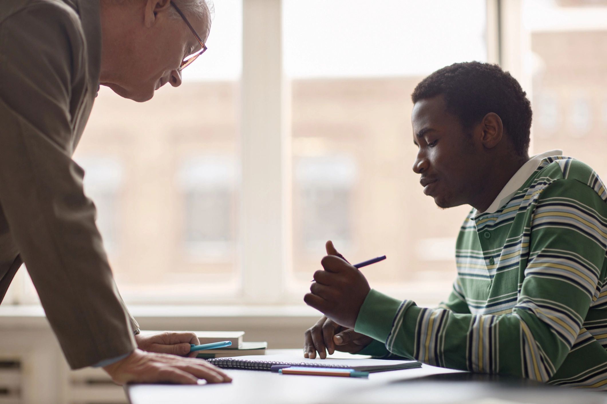 Teacher mentoring a student during a focused tutoring session