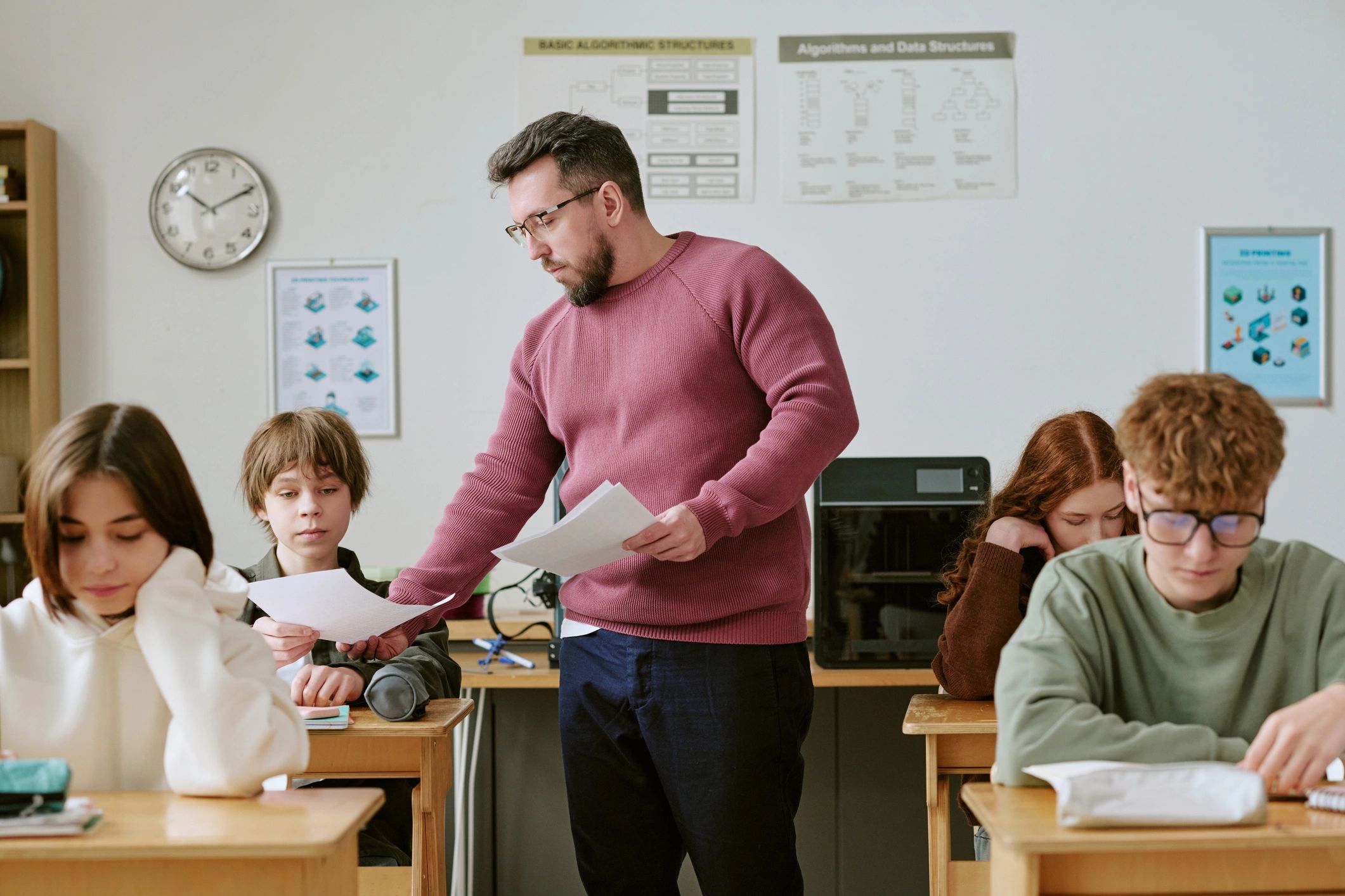 Students receiving academic guidance in class